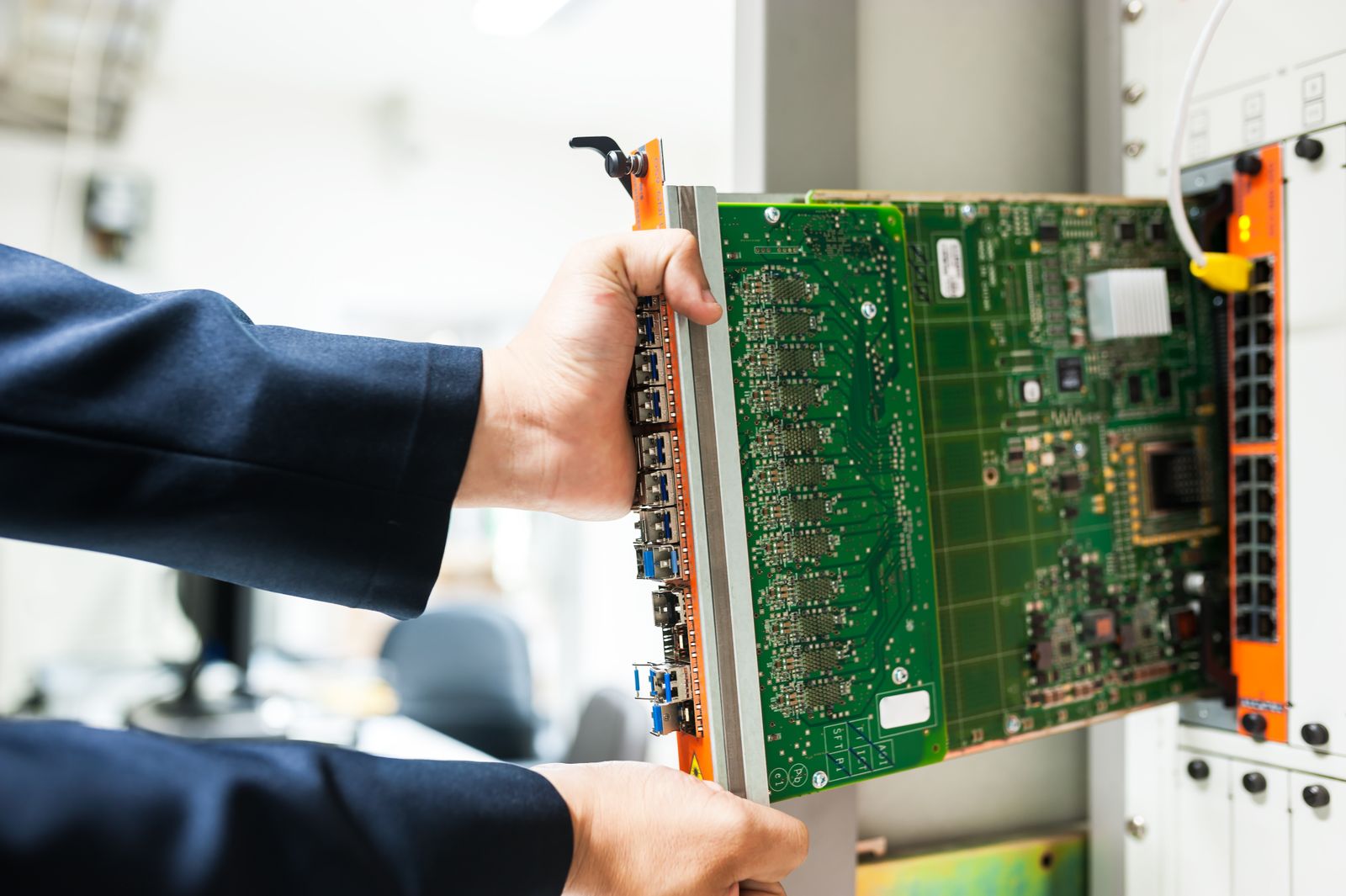On-site technician working with networking equipment